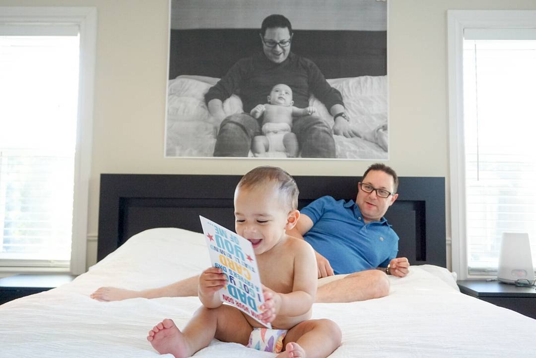 People and Pets in Front of Prints of Themselves