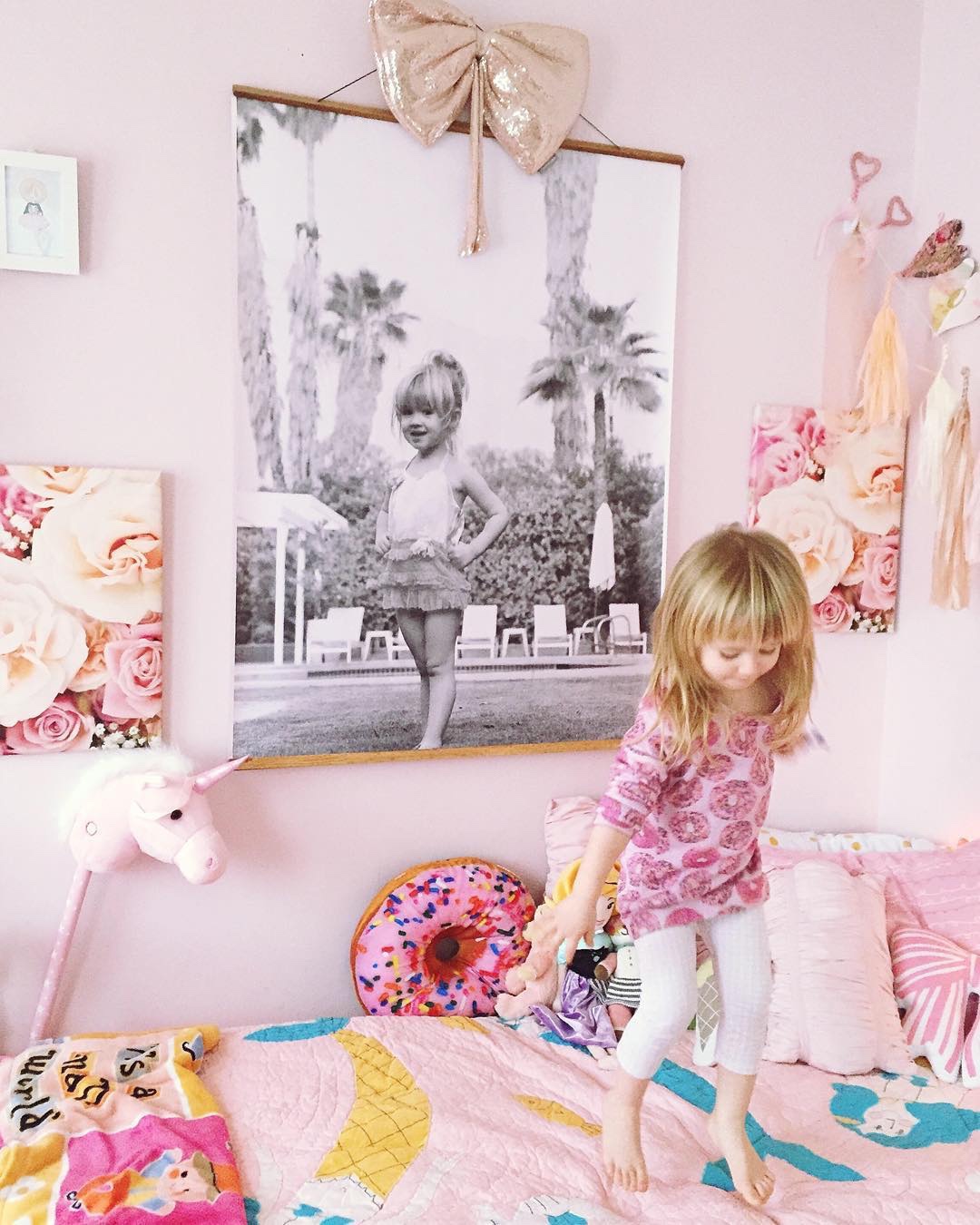 People and Pets in Front of Prints of Themselves